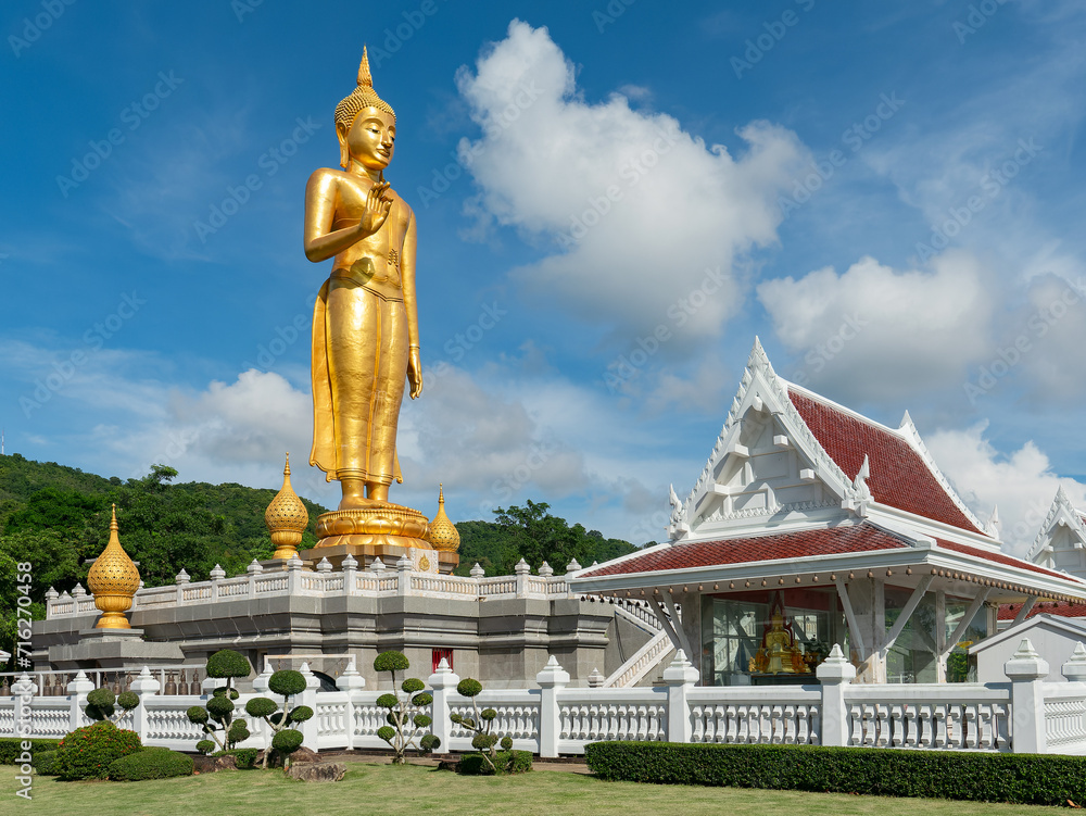 Golden standing Buddha in Hat Yai, Thailand