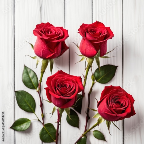 Red rose flowers over white wood background. Romantic greeting card for Valentine s Day.