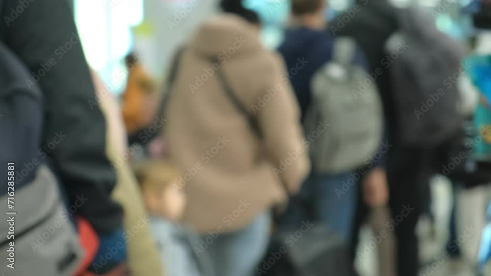 A queue inside the airport. Passengers stand in line for checking passports. 4K A queue inside the airport. Passengers stand in line for checking passports. 4K