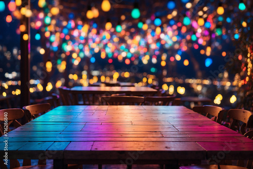 A table with a backdrop of colorful lights that blur at night