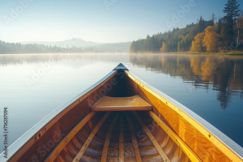 Bow of a canoe on a lake, sunny morning photo