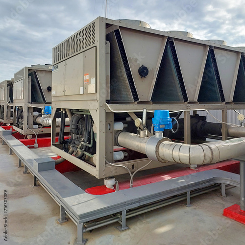 Sets of cooling towers in data center building.	 photo