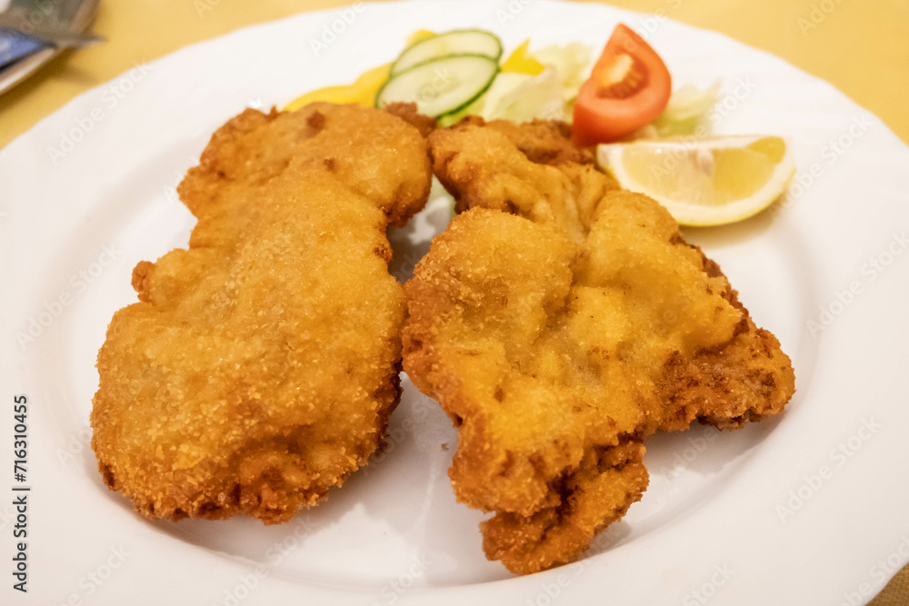 Traditional Wiener Schnitzel meal in Vienna, Austria Traditional Wiener Schnitzel meal in Vienna, Austria