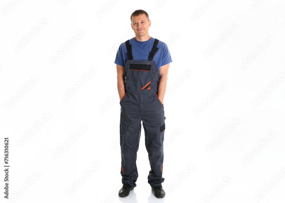 Fototapeta premium Portrait of a man in uniform worker in full growth isolated on white background