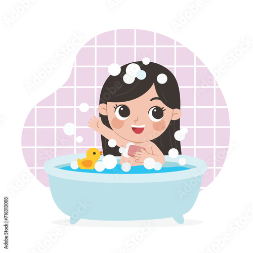 Kid taking a bath in bathtub with lot of soap lather and rubber duck.