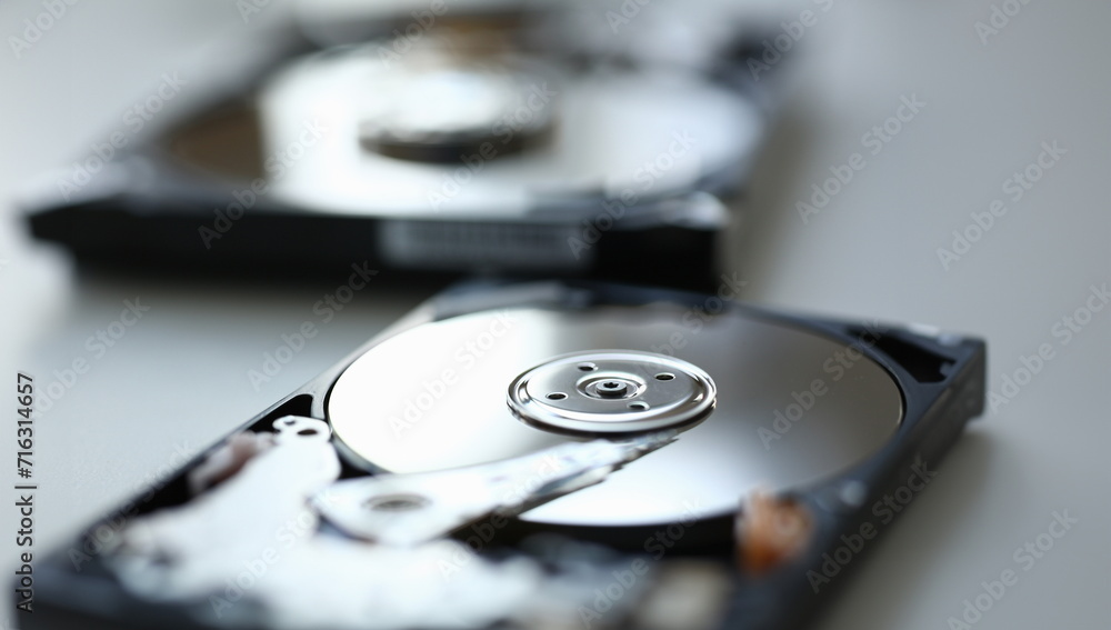 Hard drive from computer or laptop lies on the table in the repair shop. Performs fault diagnostics and performs urgent repairs recovery of lost data during deletion HDD closeup Hard drive from computer or laptop lies on the table in the repair shop. Performs fault diagnostics and performs urgent repairs recovery of lost data during deletion HDD closeup