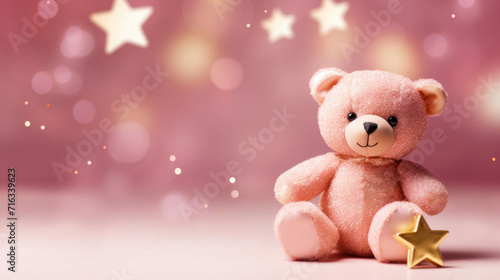 A soft pink teddy bear alongside a golden star with a dreamy pink bokeh effect in the background. © tashechka