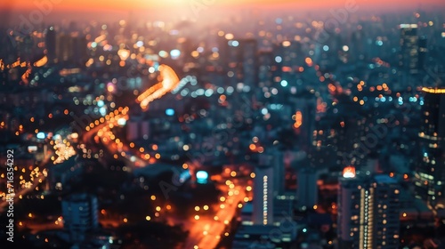 Aerial view of peaceful cityscape before sunrise in business city concept image, panoramic modern metropolis bird’s eye view at evening. Modern city with wireless network connection and city scape.