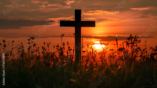 Silhouetted cross in the vibrant sunset sky, a symbol of faith, prayer, and the divine connection, blending elements of religion and nature