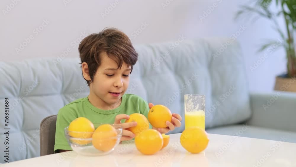 A boy's tentative bite into an orange slice, a visual representation of vitamin discovery and the development of healthy preferences, suitable for health-focused campaigns. A boy's tentative bite into an orange slice, a visual representation of vitamin discovery and the development of healthy preferences, suitable for health-focused campaigns.