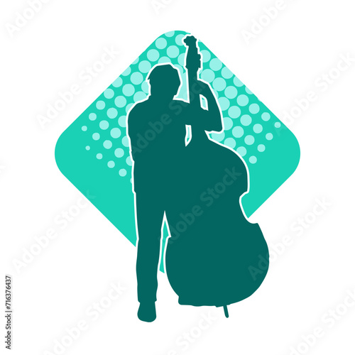 Silhouette of a classic musician playing contrabass or double bass string musical instrument.