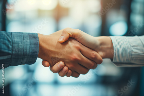 Close-up of hands in a firm handshake after a triumphant partnership in the office, A powerful image capturing the essence of mutual achievement and collaboration, Unity and teamwork concept banner.