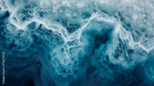 Aerial view of glacier patterns and textures, with intricate ice formations and deep blue crevasses ideal for climate change and natural wonder themes photo