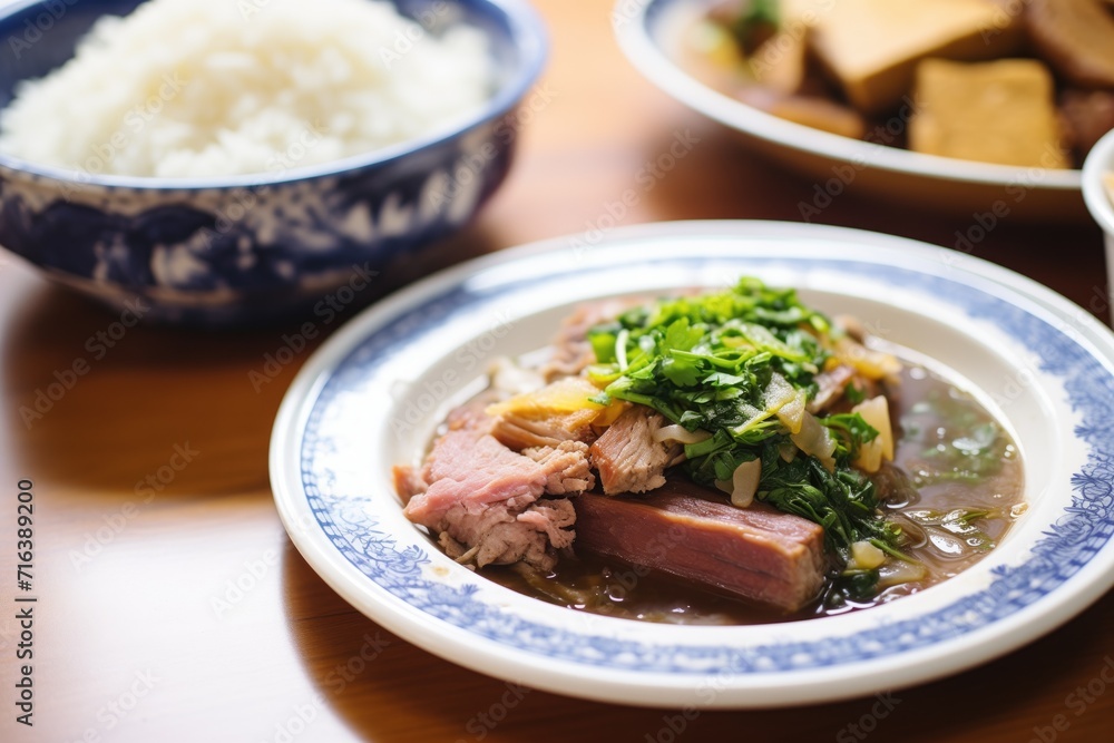 partially eaten plate of feijoada, showing layers and texture partially eaten plate of feijoada, showing layers and texture