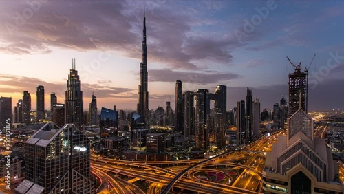 Time lapse Burj Khalifa skyline in Dubai at dramatic sunset - aerial view, United Arab Emirates photo