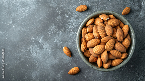 From above ceramic bowl with organic almonds