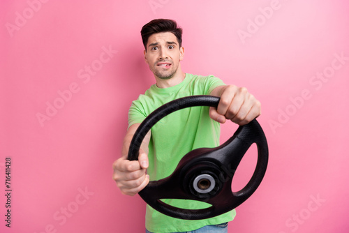 Photo of nervous guy student made mistake during the practical test when trying pass driver license isolated on pink color background
