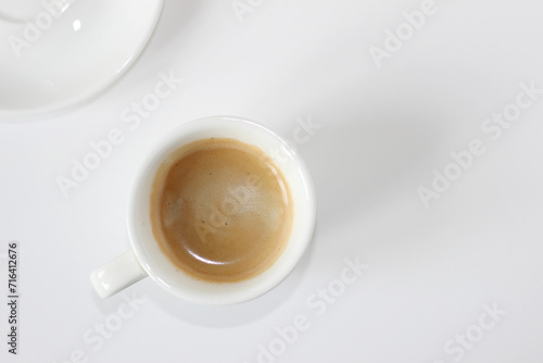 Espresso Coffee with Fresh Crema Foam on White Background. Coffee Break.