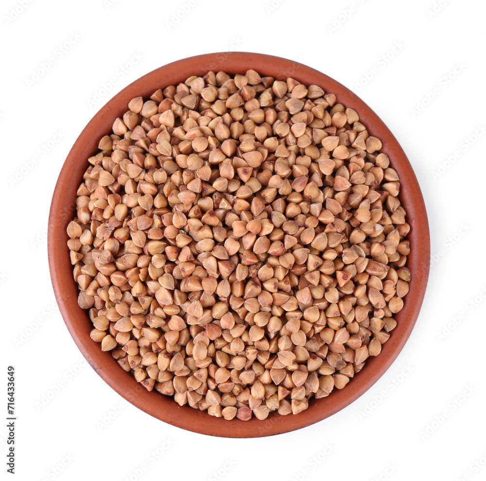 Raw buckwheat in bowl isolated on white, top view Raw buckwheat in bowl isolated on white, top view