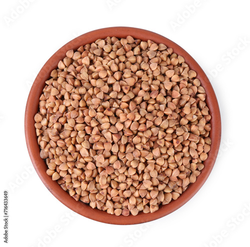 Raw buckwheat in bowl isolated on white, top view