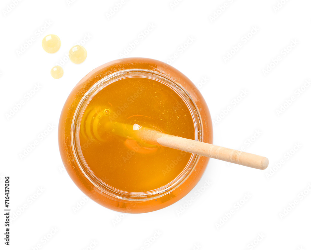Tasty honey and dipper in glass jar isolated on white, top view Tasty honey and dipper in glass jar isolated on white, top view