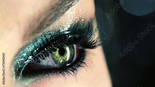 Person, eye makeup and cosmetics or closeup art for grooming glamour, eyeshadow or confidence. Beauty, disco and smokey bold for fashion style or cool festival for cyberpunk, party trend or glitter photo