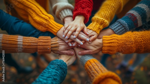 Teamwork and Friendship A powerful stacked hands symbolizing unity, motivation, and encouragement within a diverse team, highlighting the strength that comes from collaborative efforts and diversity