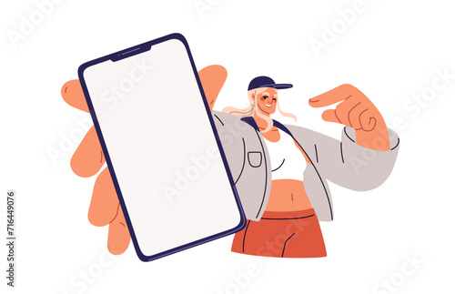 Happy girl showing mobile phone screen. Young woman holding smartphone, cellphone mockup. Female pointing at blank cell display, advertising app. Flat vector illustration isolated on white background