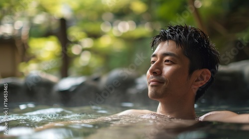 Portrait of a Young Asian Man Relaxing in Hot Springs. Generative AI.