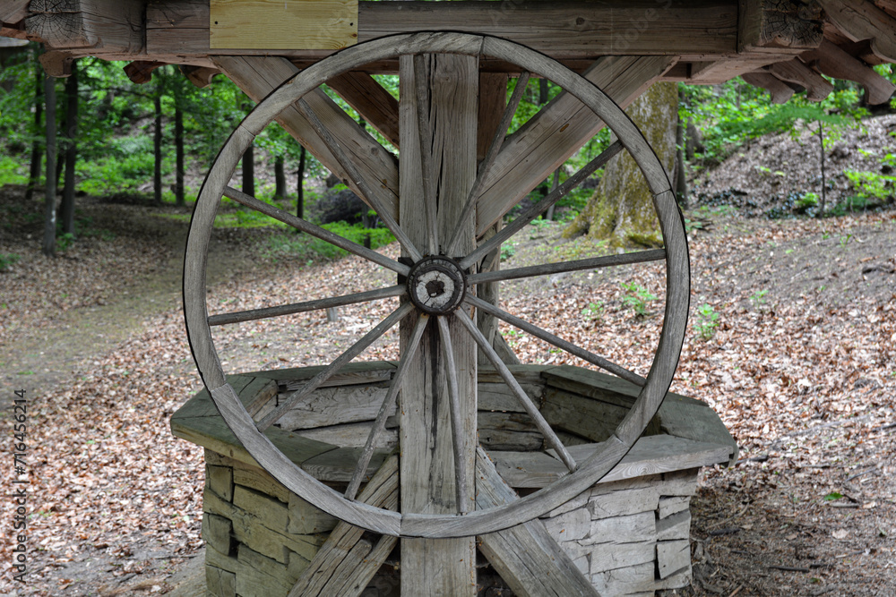 old wooden well with a wheel.