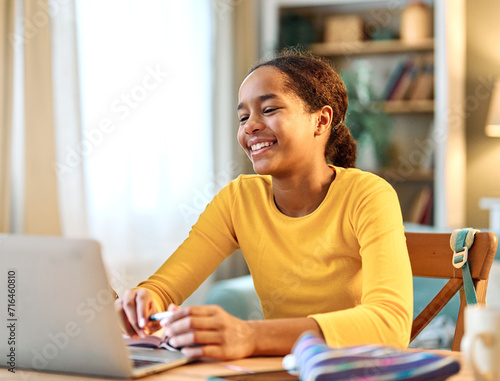 child laptop computer technology home girl education homework teenage learning kid internet childhood student black teen using online young happy photo
