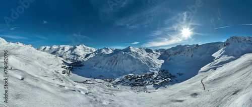 Winter drone shot of ski pistes and slopes covered with fresh powder snow in Tignes in Valdisere France