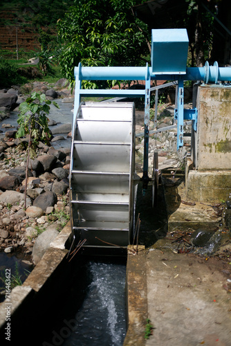 water wheel on the side of river