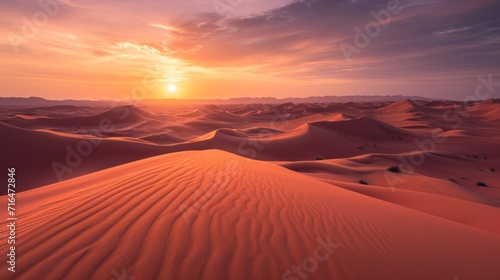 Sunset in the desert with dunes