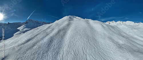 Winter drone shot of ski pistes and slopes covered with fresh powder snow in Tignes in Valdisere France photo