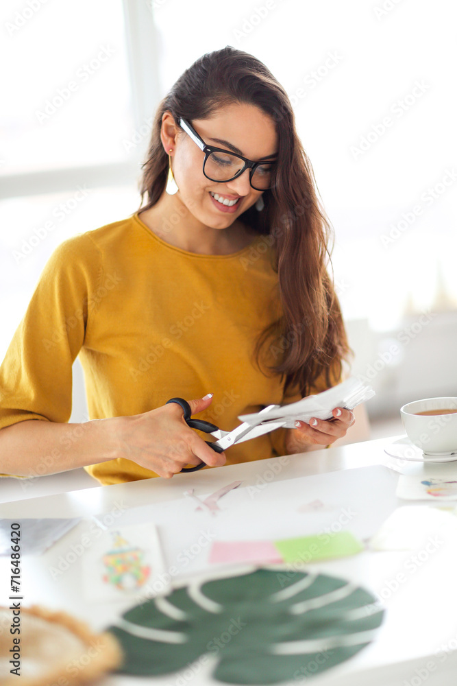 Young brunette woman creating her Feng Shui wish map Young brunette woman creating her Feng Shui wish map