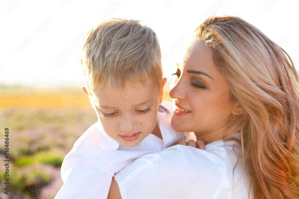 Happy young mother and her little in lavender field Happy young mother and her little in lavender field