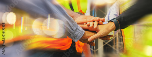 Tableau sur toile Team multi-ethnic workers, men and women, join hands to join forces to join forces to work for the industry for success