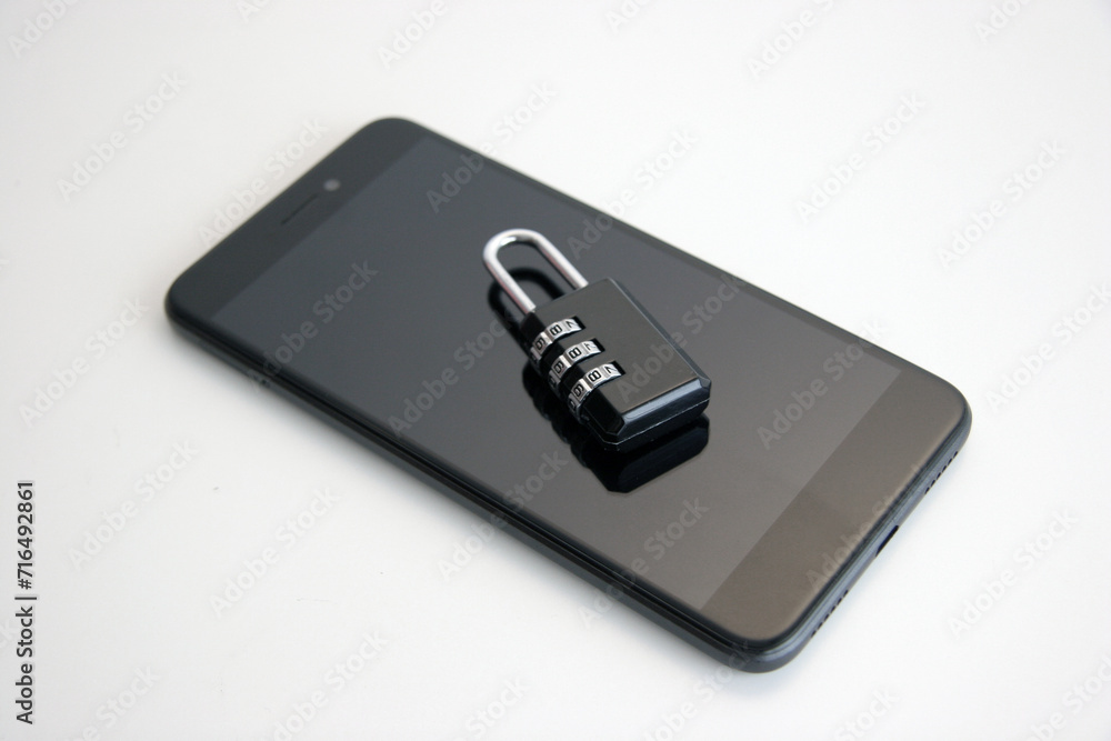 Smartphone with combination padlock. Mobile security concept. Smartphone with combination padlock. Mobile security concept.