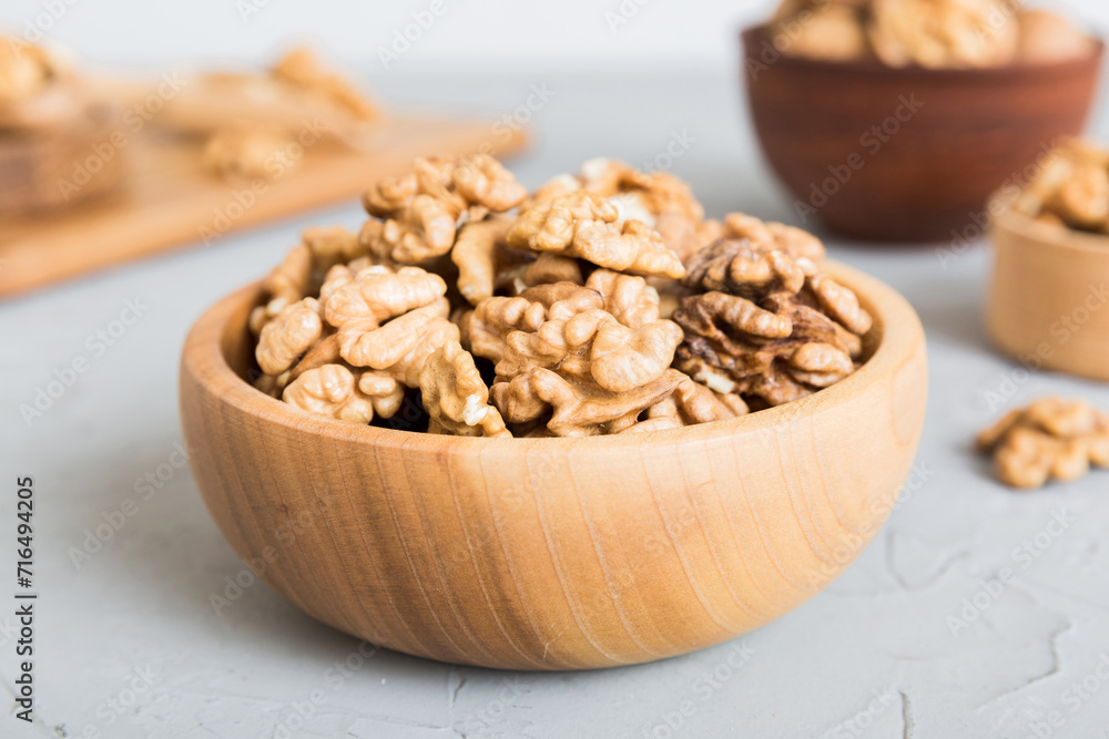 Fresh healthy walnuts in bowl on colored table background. Top view Healthy eating bertholletia concept. Super foods Fresh healthy walnuts in bowl on colored table background. Top view Healthy eating bertholletia concept. Super foods