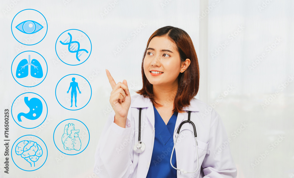 Female internal medicine doctor in the picture in a white robe with gentle medical stethoscope is a doctor who specializes in the use of medicine for almost all common diseases. Female internal medicine doctor in the picture in a white robe with gentle medical stethoscope is a doctor who specializes in the use of medicine for almost all common diseases.