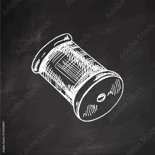 Hand-drawn sketch of skein of thread on chalkboard background. Handmade, sewing equipment concept in vintage doodle style. Engraving style.	