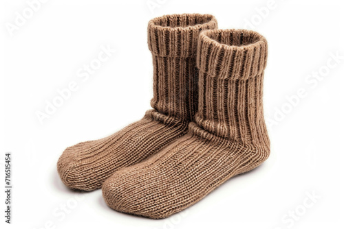 A pair of camel wool socks on white background