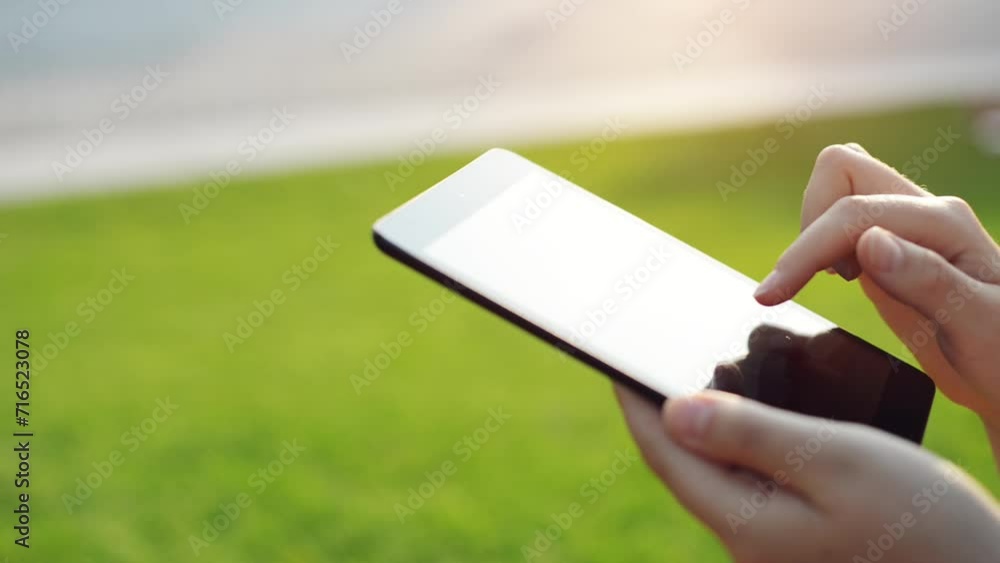 Hands, phone and typing on screen in outdoors, internet connection and scrolling on social media. Closeup, person and texting on smartphone in nature, mobile app and networking or communication Hands, phone and typing on screen in outdoors, internet connection and scrolling on social media. Closeup, person and texting on smartphone in nature, mobile app and networking or communication