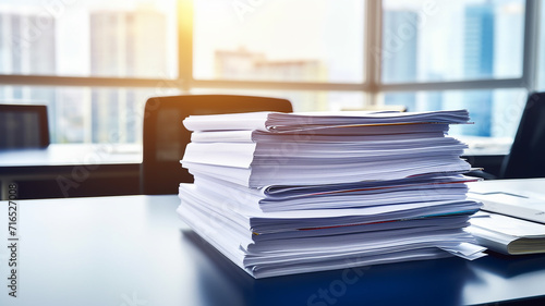 a stack of accounting documents on the desk in the office background copy space document flow