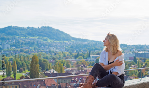 Vacation in Switzerland - Bern. Concept of tourism and holidays. Woman in city streets, urban scene