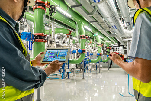 asian man factory technologist. Industrial worker. Chemical plant specialist.