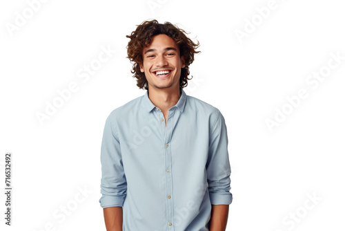 Charming young man with curly hair, wearing a light blue shirt, radiates confidence and friendliness against a transparent background photo
