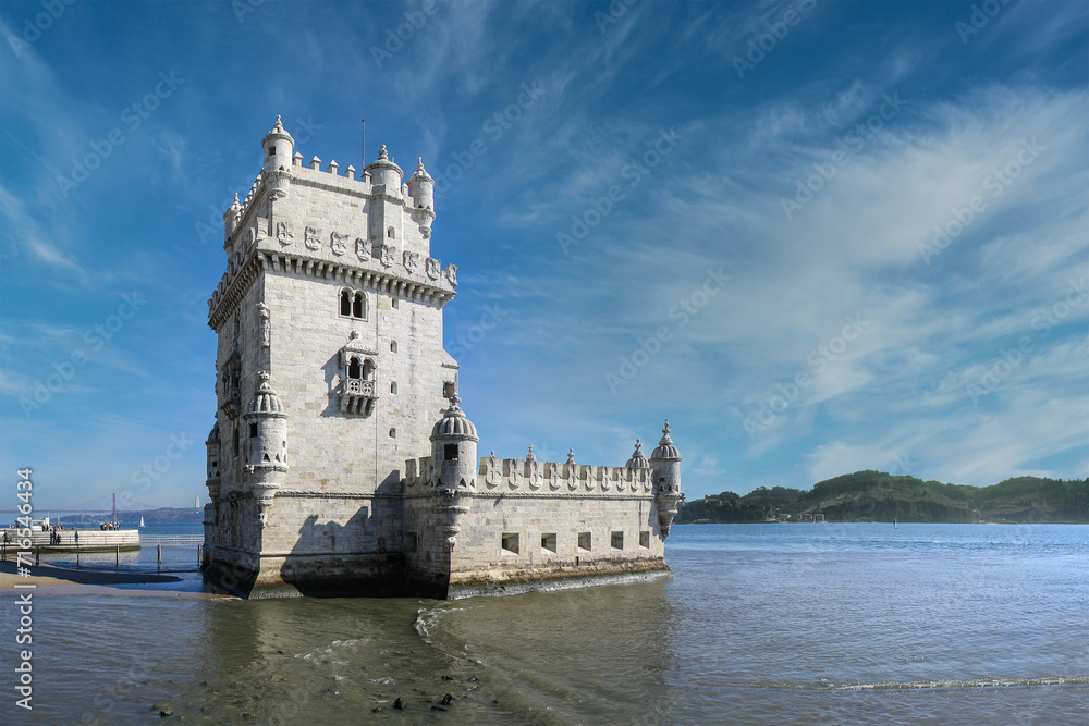 Torre de Belem Tower and a view of the River Tagus aka Tejo or Tajo in Lisbon, Portugal. Classified as UNESCO World Heritage it stands as the best example of the Manuelino art.