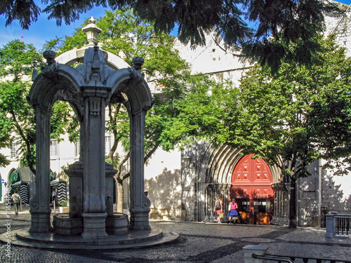 Largo do Carmo Square with the Chafariz do Carmo Fountain and the entrance to the ruins of the Gothic Church of the Convento do Carmo Convent aka Our Lady of Mount Carmel. Lisbon, Portugal